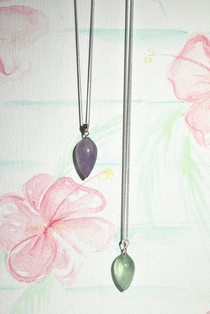 A Fluorite gemstone that has been hand formed into a sweet rounded droplet shape, it has a magical prettiness all of its own.&nbsp;

Fluorite gemstone hand carved into a rounded drople