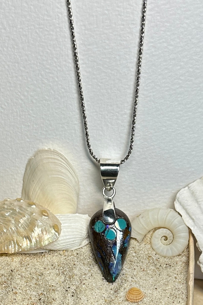 The opal has deep rivulets of very bright blue with green flashes and a sparkle of red. An Australian solid boulder opal pendant which has been inlaid with Arizona Turquoise. The pendant bail is silver Solid Australian Boulder Opal.
