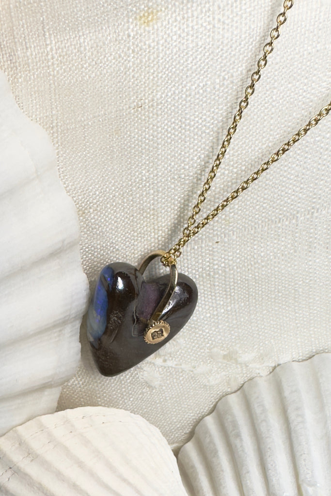 This is an absolute stunner, a lovely chunk of Australian opal carved into a heart the embellished with a repurposed 18ct gold earring being used as the bail.