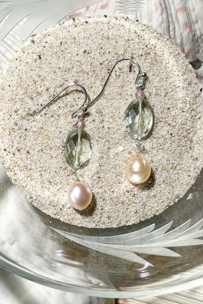 The earrings Crystal Lake are as fresh and pretty as a mountain stream. Sparkling pale minty green with pearls and softest pink.

Green Prasiolite faceted bead.
Peachy pink freshwater pearl.
Drop style earrings statement earrings.