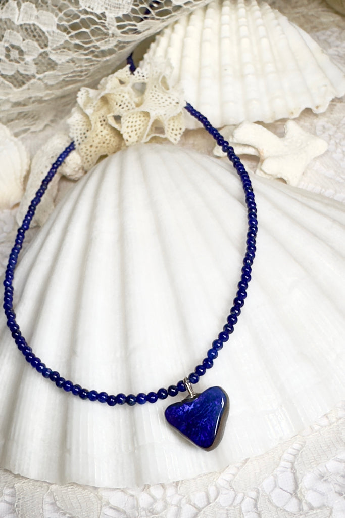 So chic, a bright splash of cobalt blue, solid boulder opal cut into a tiny heart it hangs from a deep blue Lapis Lazuli tiny bead necklace. 