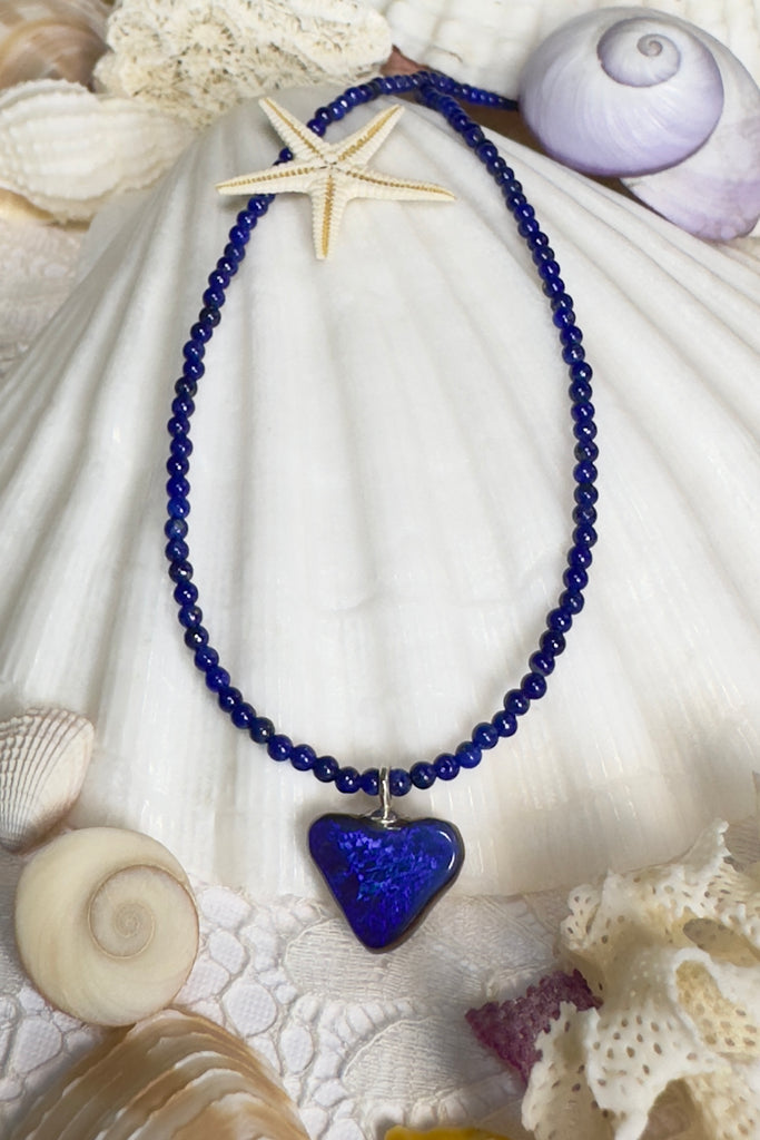 So chic, a bright splash of cobalt blue, solid boulder opal cut into a tiny heart it hangs from a deep blue Lapis Lazuli tiny bead necklace. 