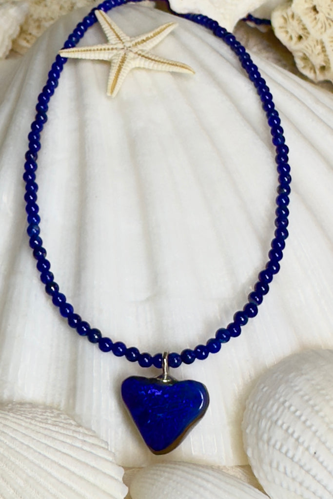 So chic, a bright splash of cobalt blue, solid boulder opal cut into a tiny heart it hangs from a deep blue Lapis Lazuli tiny bead necklace. 