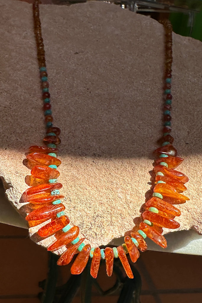 Necklace of glowing Baltic Amber set off with natural Turquoise beads, an interesting detail are the little Carnelian beads and the golden Citrine beads.

Gemstones are Natural Baltic Amber Baltic Amber purchased directly from source.&nbsp;
Natural Turquoise, Carnelian and Citrine.