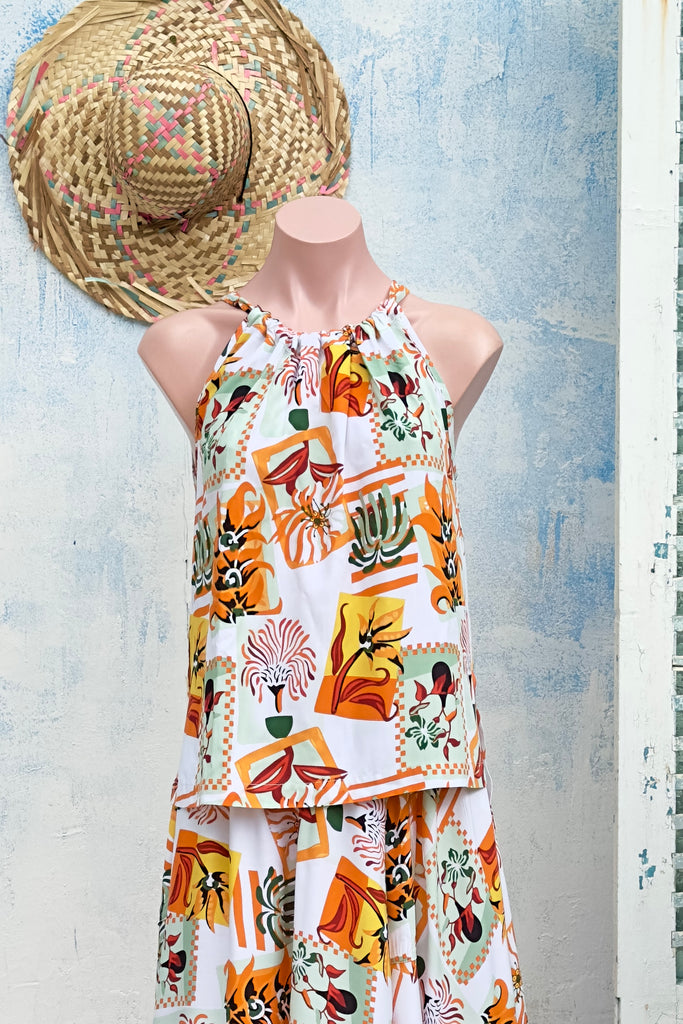 Nuance Tan Postcards Tie Top. The adjustable neckline adds versatility while the bloused cut offers a relaxed and stylish fit.