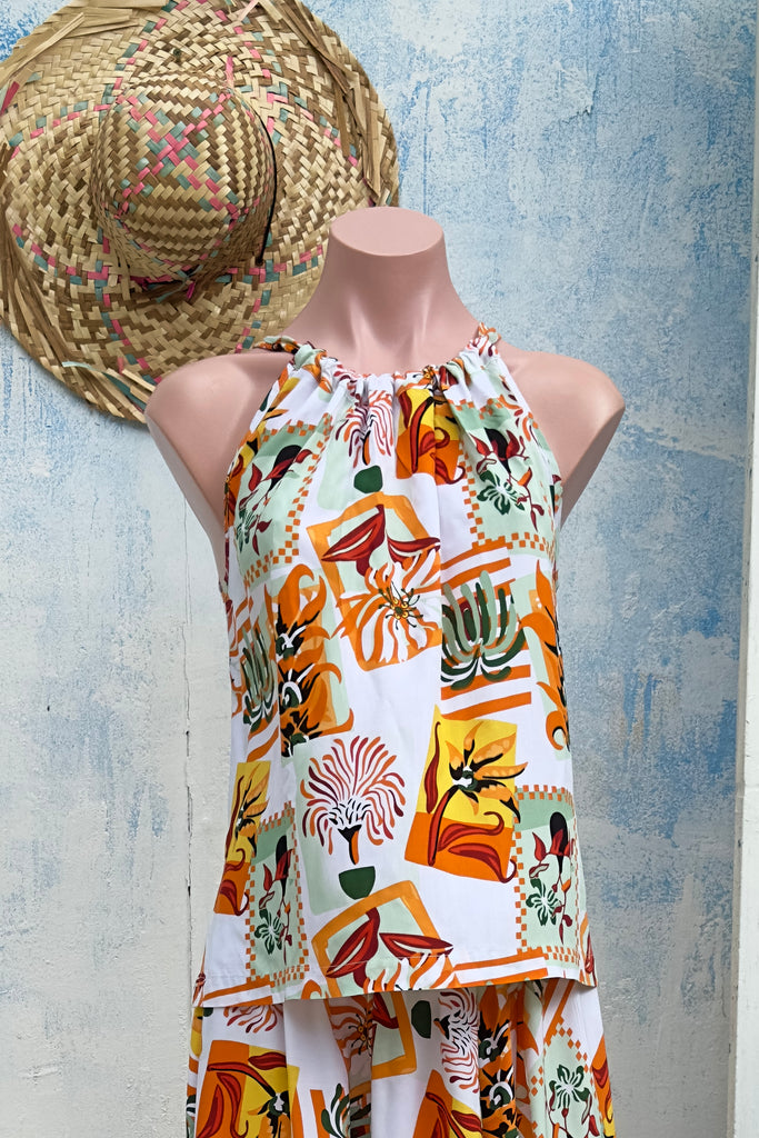 Nuance Tan Postcards Tie Top. The adjustable neckline adds versatility while the bloused cut offers a relaxed and stylish fit.