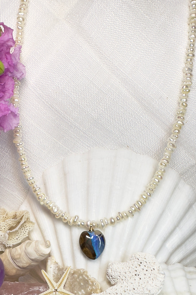 A new and modern design, tiny pearls and a pretty Australian Boulder opal heart pendant. The heart appears divided between the sea and the land.