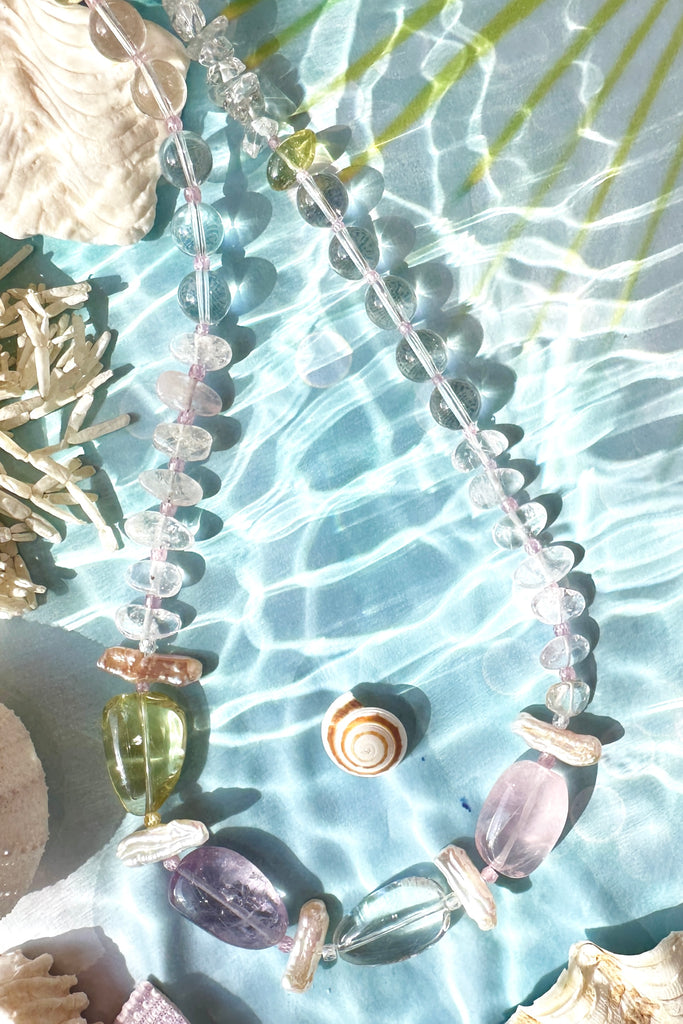 A dreamy crystal necklace with pretty tumbled beads and baroque pearls. None of the stones are perfect, some are village cut and some are highly polished.&nbsp;

Necklace is 52cm in length.