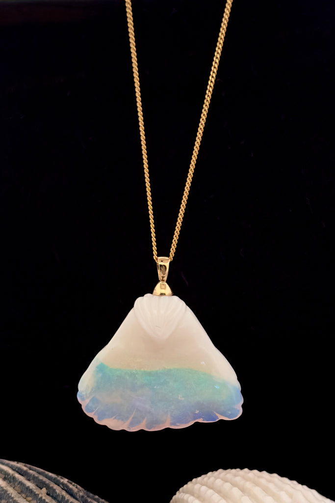 An absolute stunner, this mystical crystal opal skilfully carved into the shape of a whale tail, a dreamy opal pendant that is a one off piece. 