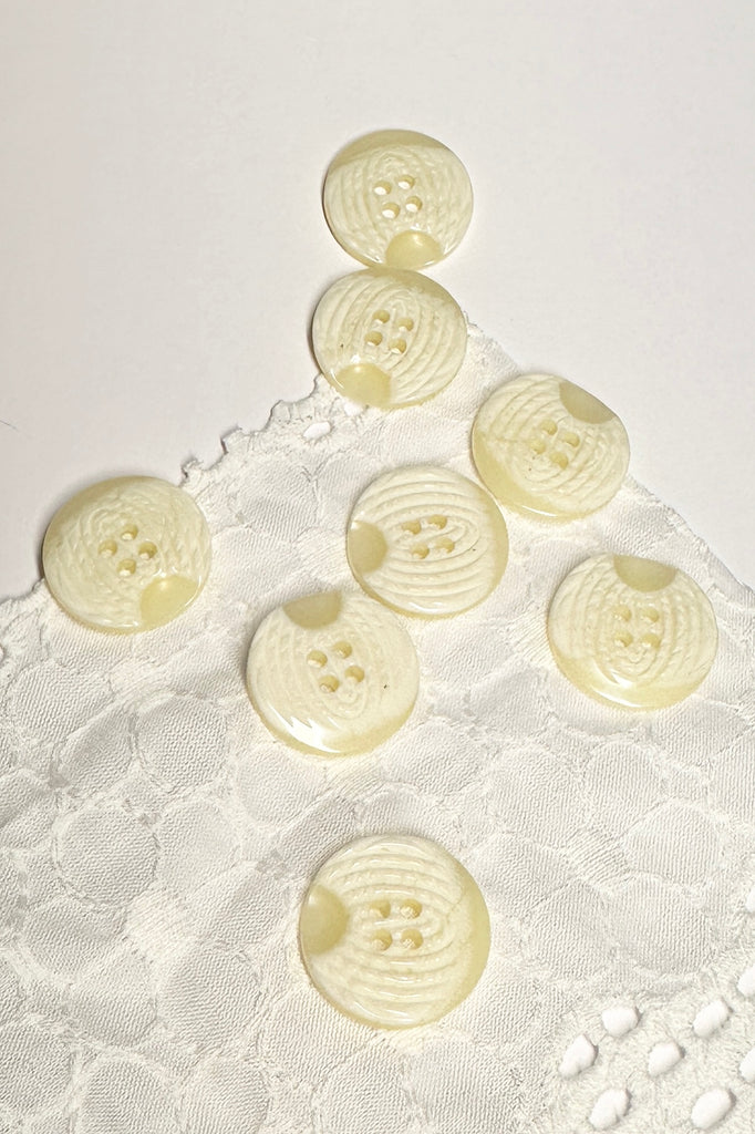 These pretty buttons have a swirling pattern on the top, great to use on jackets or skirts.
