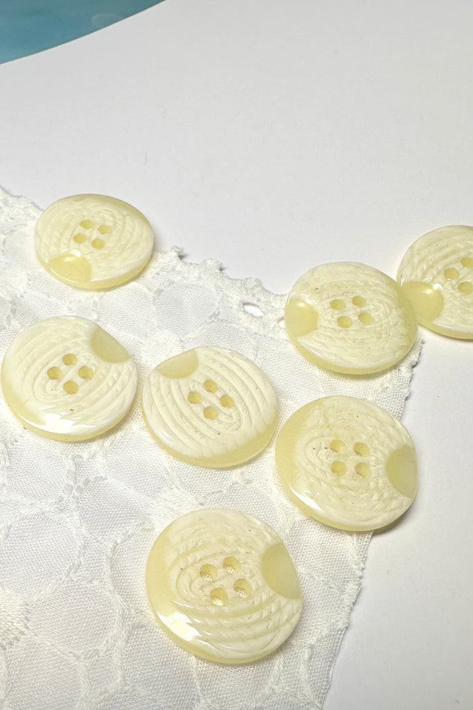 These pretty buttons have a swirling pattern on the top, great to use on jackets or skirts.