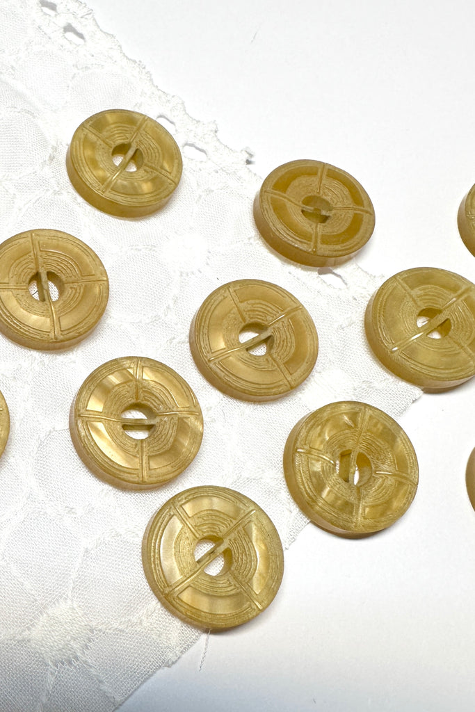 These unusual buttons have two holes separated by a bar, great to use on jackets or skirts.