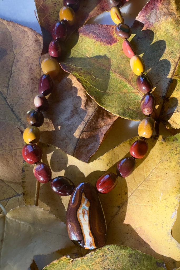 Solid Boulder Opal pendant on a necklace of Mookaite beads.
Opal has softly coloured crystalline drift down the centre.
Australian Mookaite stone beads found only in the Kennedy ranges of Western Australia.