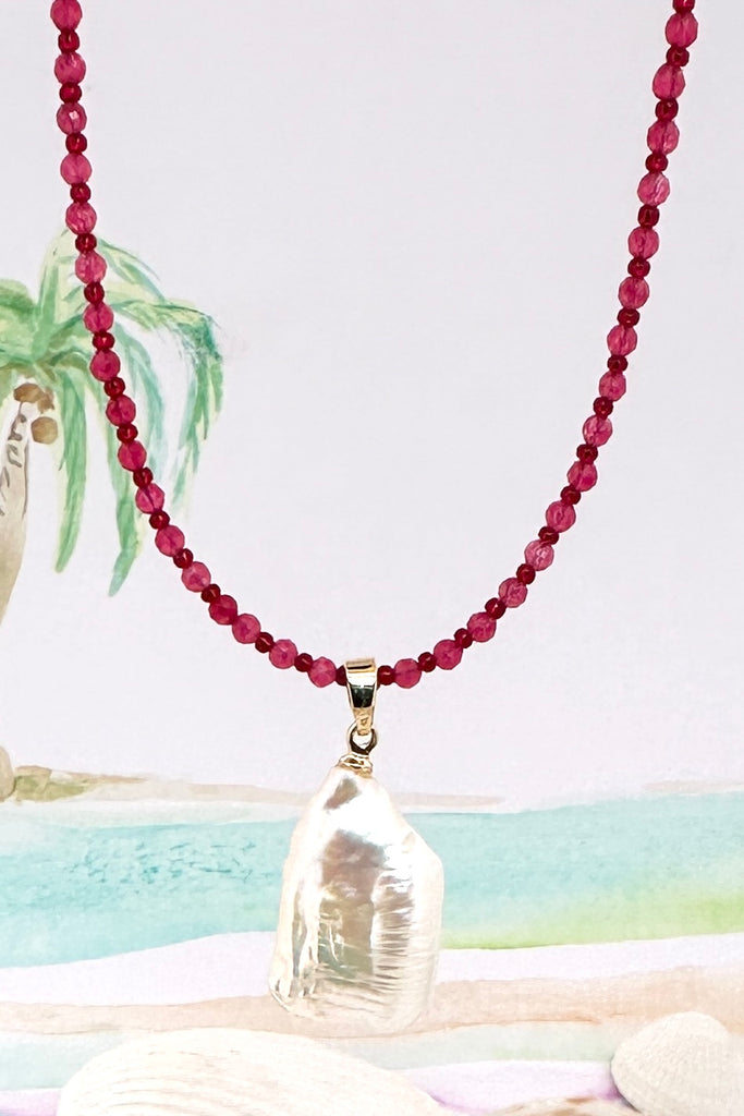 So pretty so chic, this large Baroque pearl hangs off a necklace of tiny faceted pink quartz beads, minimal with a touch of romance.