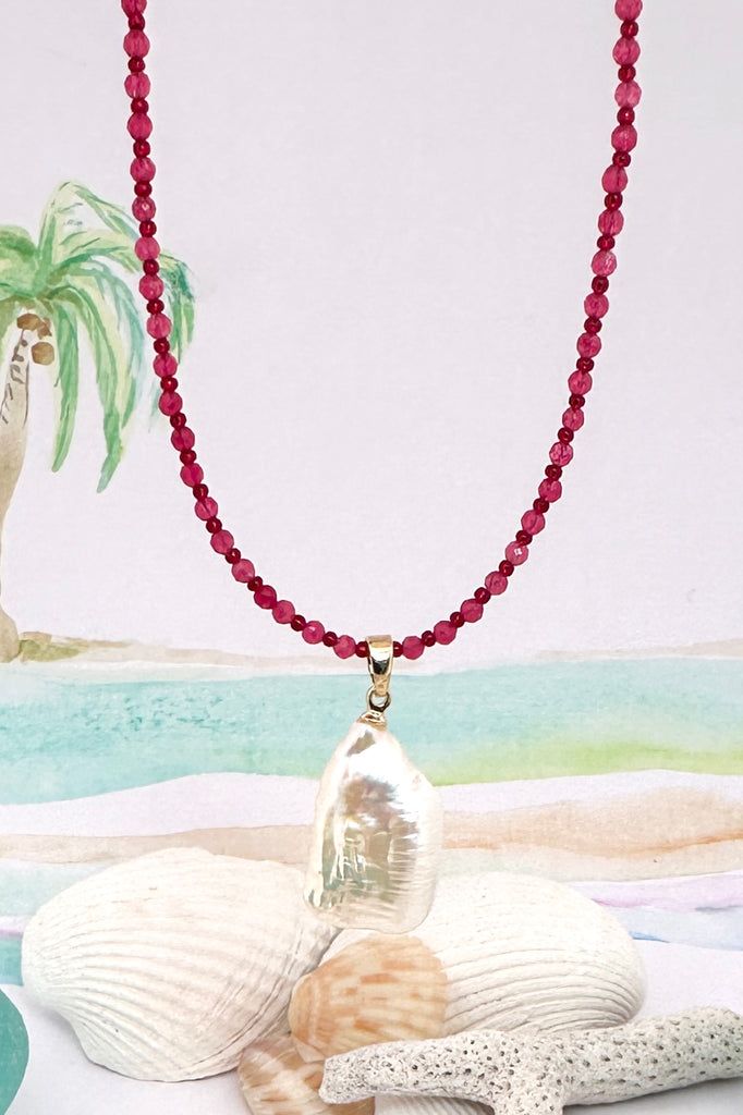 So pretty so chic, this large Baroque pearl hangs off a necklace of tiny faceted pink quartz beads, minimal with a touch of romance.