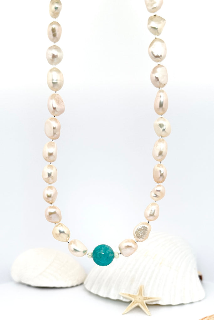 A necklace of creamy white pearls with a sea swirl of Amazonite bead as the centrepiece, perfect ocean inspired necklace