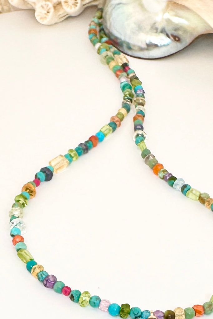 pretty and modern, this teeny tiny&nbsp; opal is the centrepiece on a multi stone bead gemstone necklace that sparkles in the light
