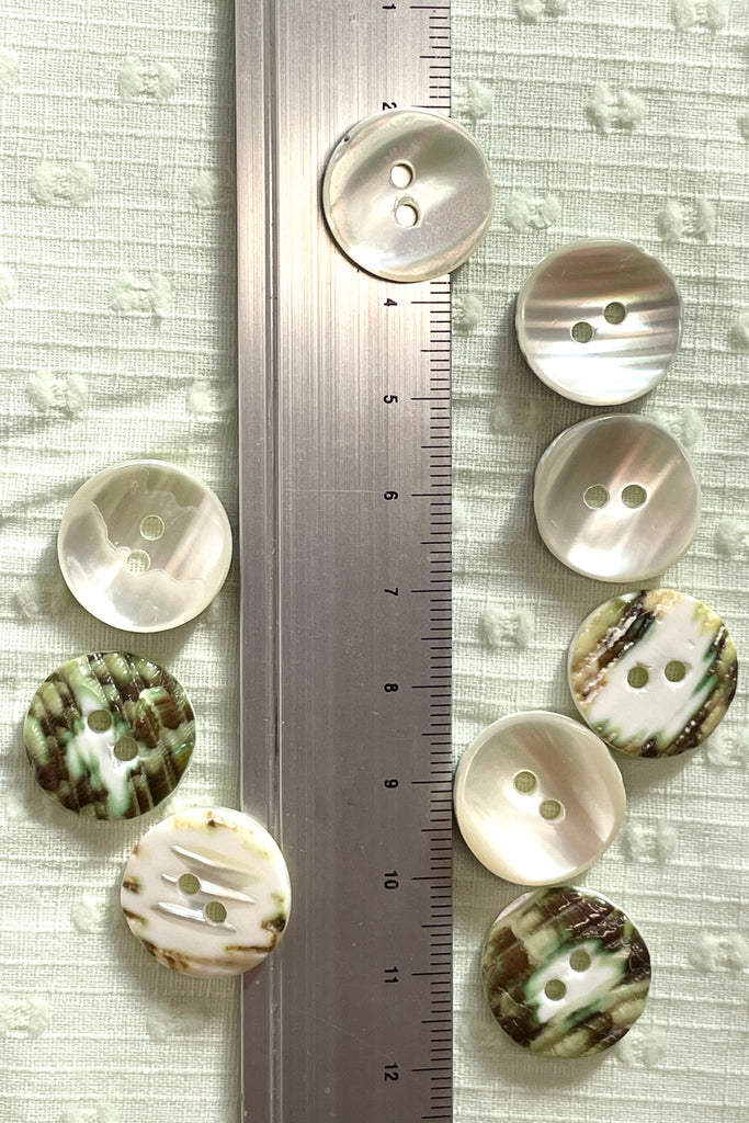 Our Buttons White Trochus Shell Buttons are perfect for any special project. 