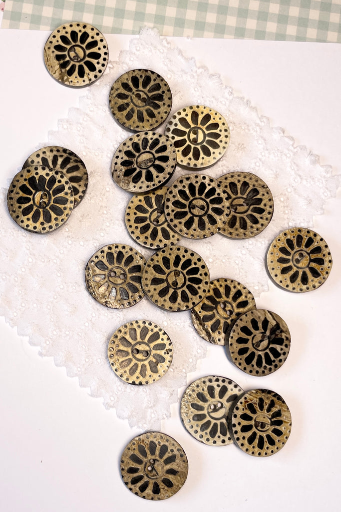 These quirky buttons are carved from horn in India, they are extremely unusual. Suitable for a jacket or skirt, every flower and button is different.