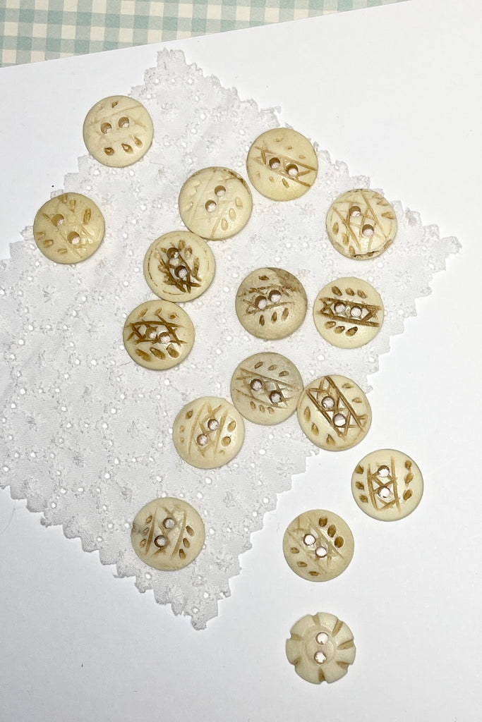 These quirky buttons are carved from bone in India, they are extremely unusual, the holes are all placed differently showing that these are indeed a "village" make, every pattern and button is different.