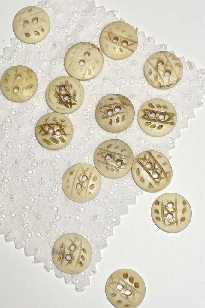 These quirky buttons are carved from bone in India, they are extremely unusual, the holes are all placed differently showing that these are indeed a "village" make, every pattern and button is different.