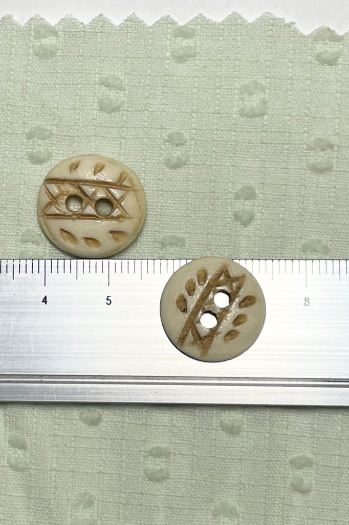 These quirky buttons are carved from bone in India, they are extremely unusual, the holes are all placed differently showing that these are indeed a "village" make, every pattern and button is different.