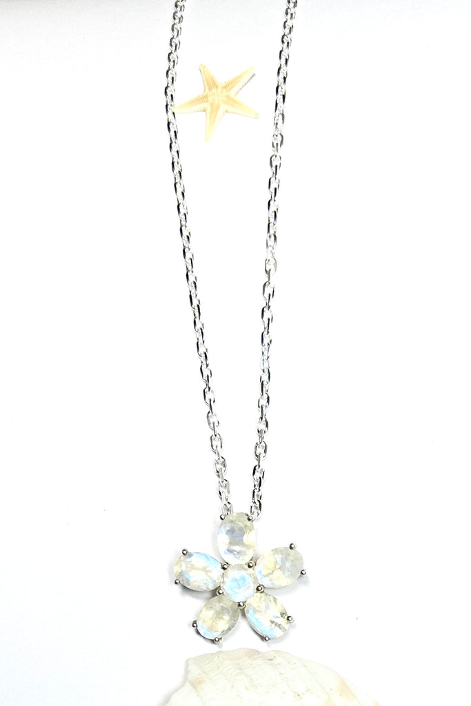 this Moonstone daisy pendant will add a touch of whimsy unicorn energy to any outfit.