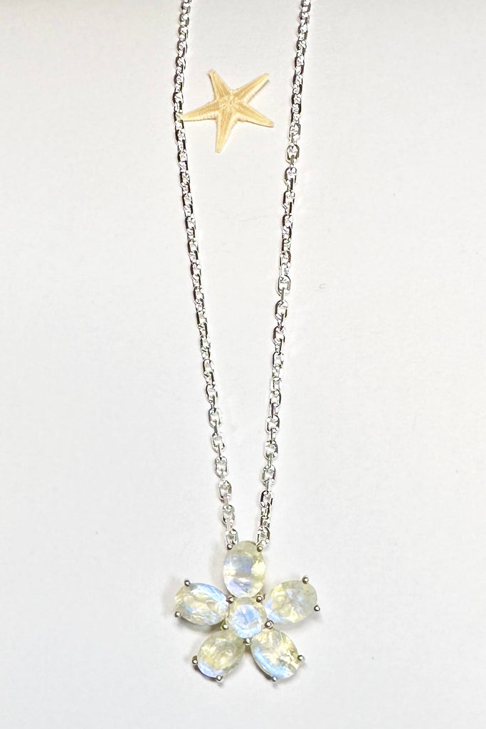 this Moonstone daisy pendant will add a touch of whimsy unicorn energy to any outfit.