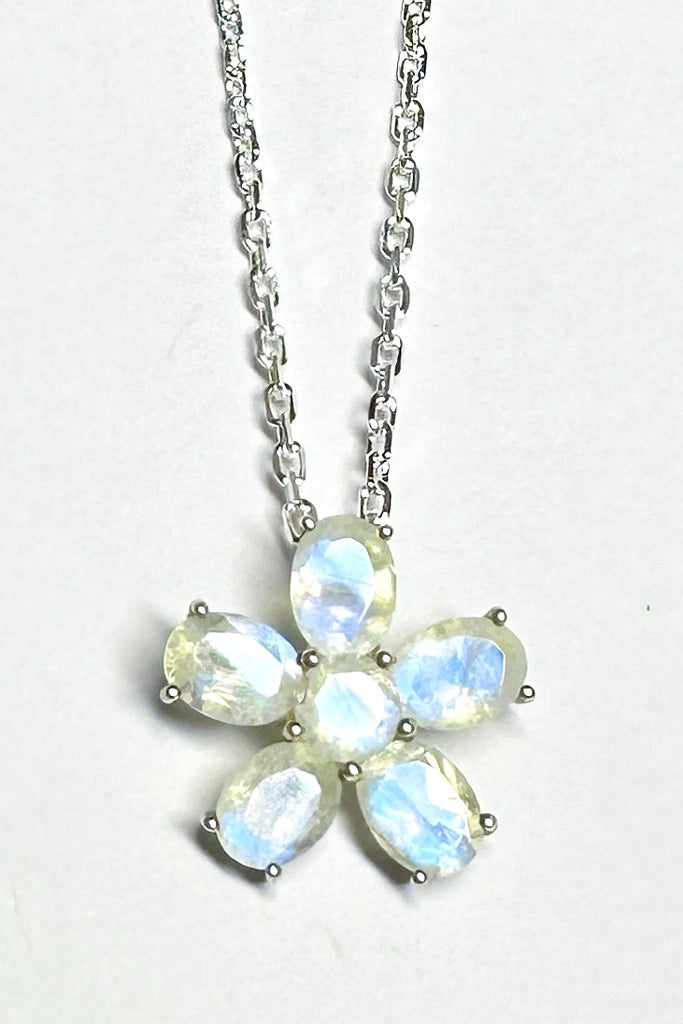 this Moonstone daisy pendant will add a touch of whimsy unicorn energy to any outfit.