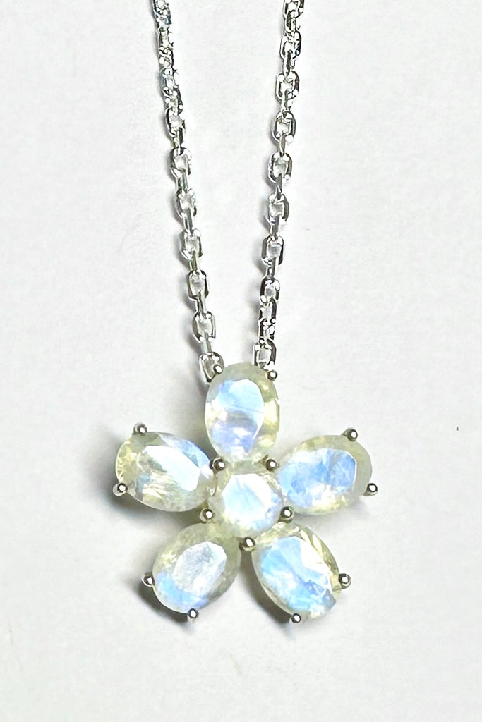 this Moonstone daisy pendant will add a touch of whimsy unicorn energy to any outfit.