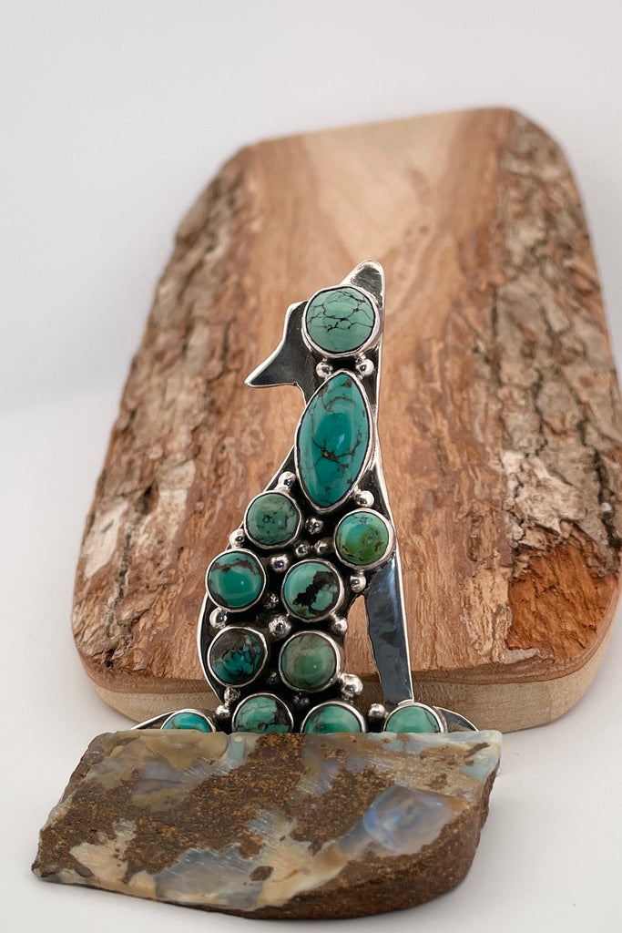 Vintage Coyote Brooch/pendant, the coyote dog has been set with twelve hand cut natural turquoise cabochons. This brooch has a wonderful power, it seems to carry the spirit of the maker. Made and marked in 925 silver