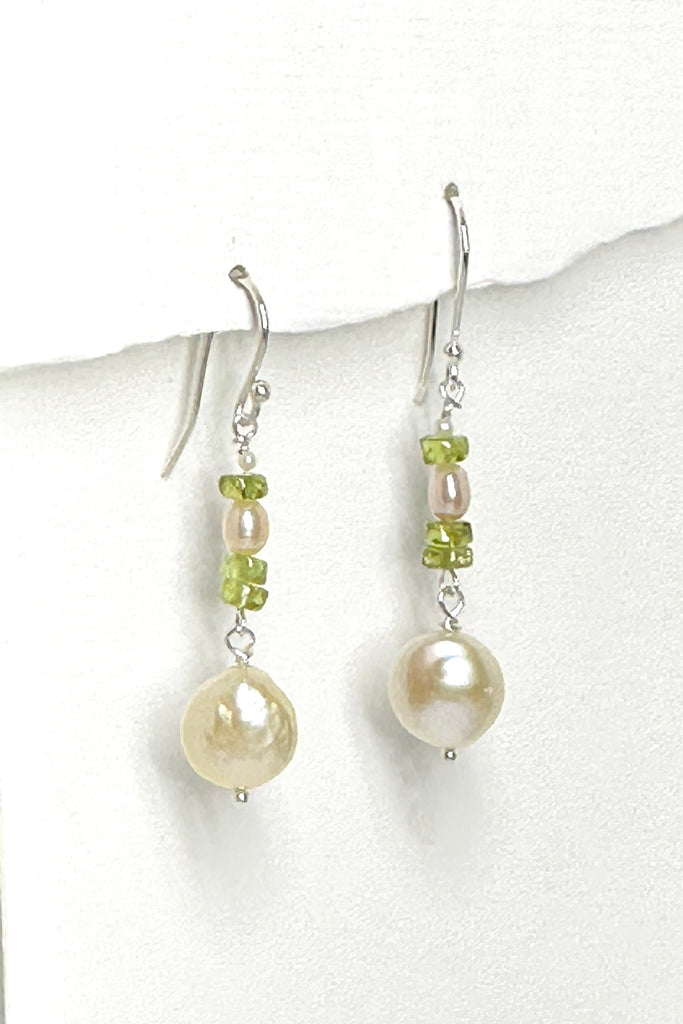 These earrings are so natural and chic, pale green Peridot and pearls, the lustrous coin pearl is dangling below to give movement to the piece.