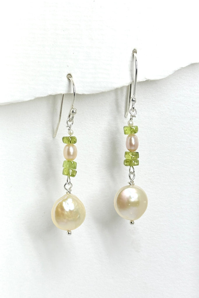 These earrings are so natural and chic, pale green Peridot and pearls, the lustrous coin pearl is dangling below to give movement to the piece.