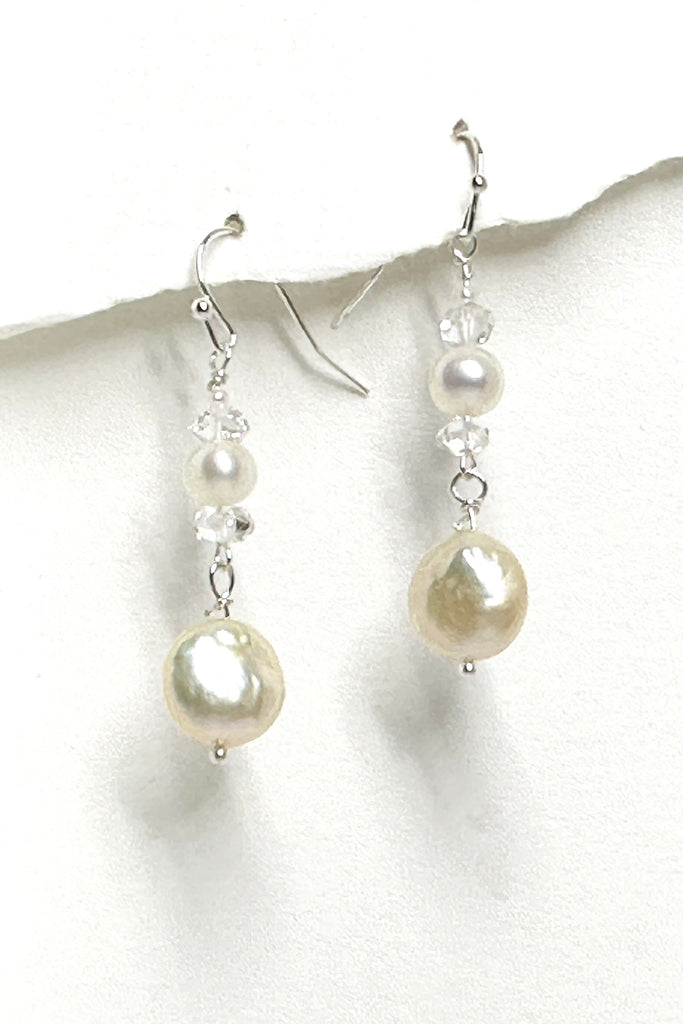 These romantic earrings are so ethereal, Herkimer Diamonds enhance the lustrous pearls, the coin pearl is dangling below to give movement to the piece. 