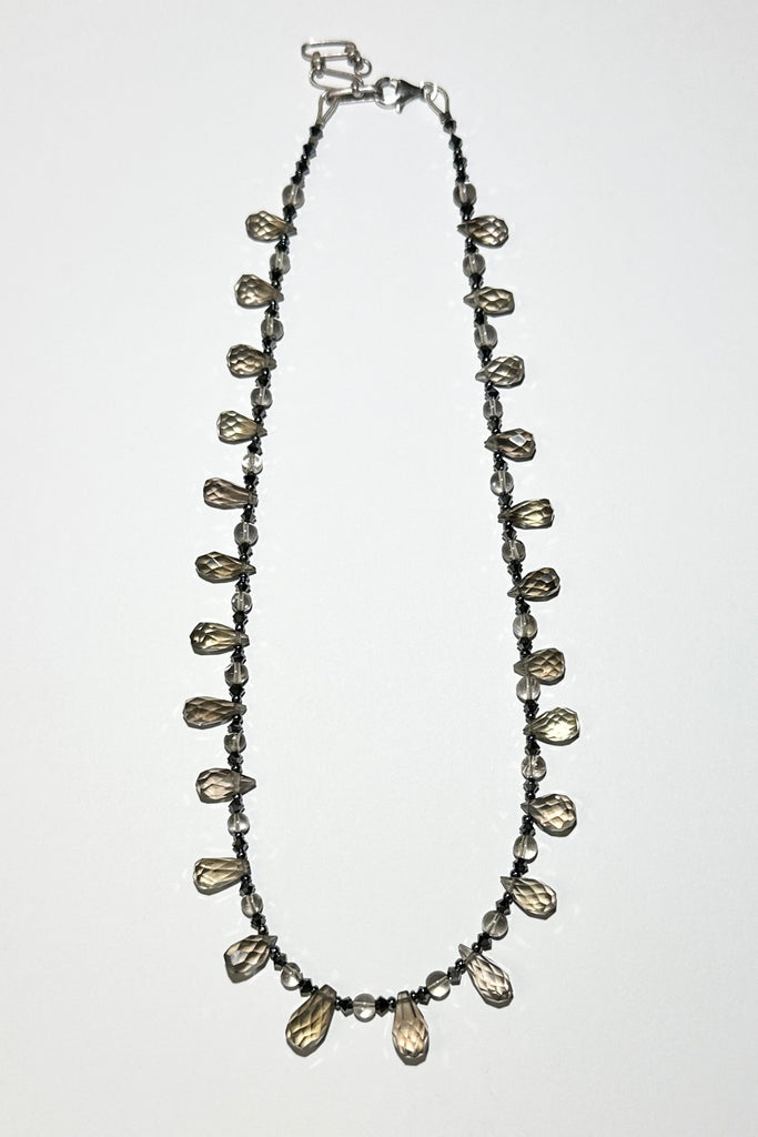 moky quartz necklace was made using sparkly faceted briolette cut stones along with swarovski crystals as a highlight.