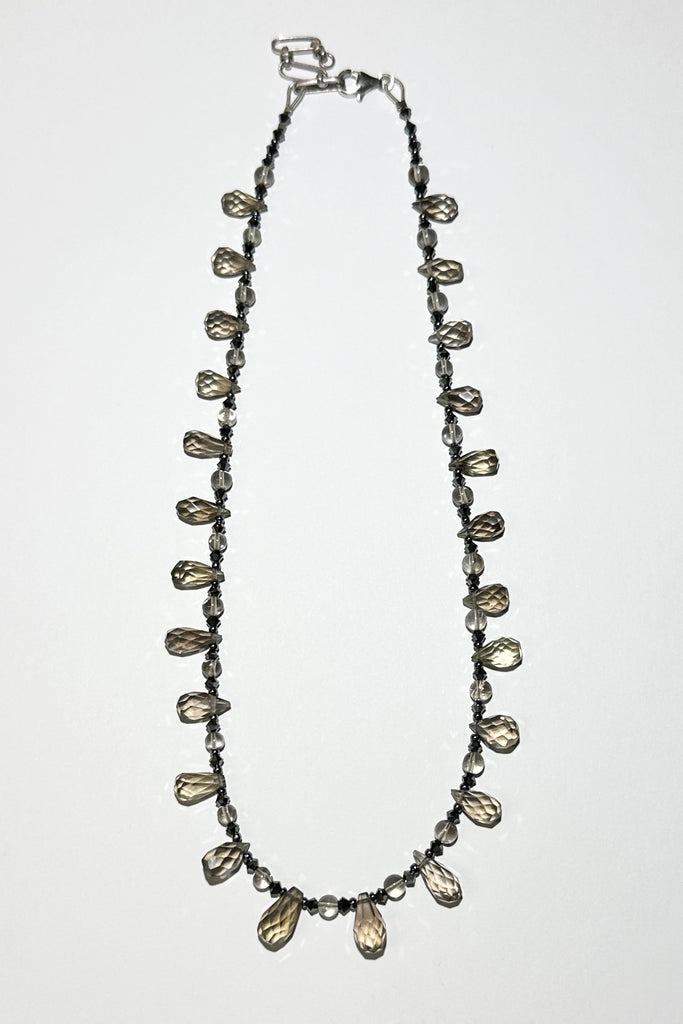 moky quartz necklace was made using sparkly faceted briolette cut stones along with swarovski crystals as a highlight.