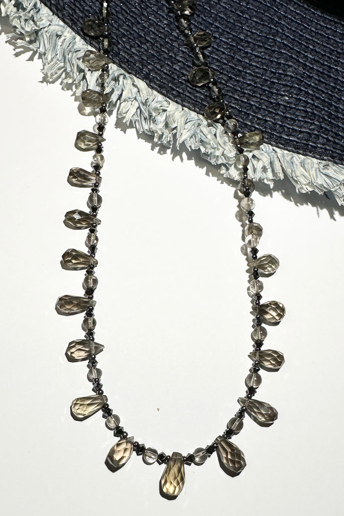 moky quartz necklace was made using sparkly faceted briolette cut stones along with swarovski crystals as a highlight.