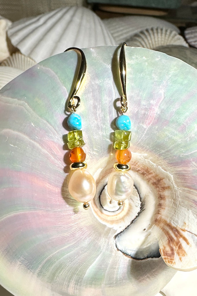 Colourful and chic, our Inez gemstone earrings bring a joyous pop of pretty multicoloured gemmy stones to your look.
Gemstones are natural Kingman Turquoise, freshwater pearls, Peridot, and Carnelian.