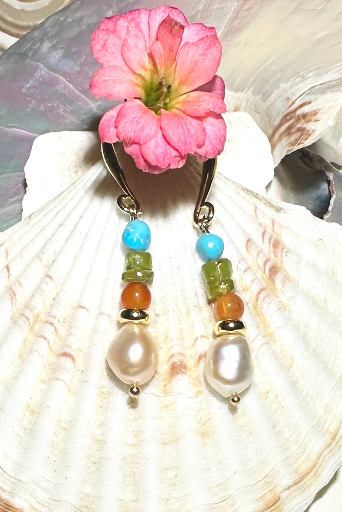 Colourful and chic, our Inez gemstone earrings bring a joyous pop of pretty multicoloured gemmy stones to your look.
Gemstones are natural Kingman Turquoise, freshwater pearls, Peridot, and Carnelian.