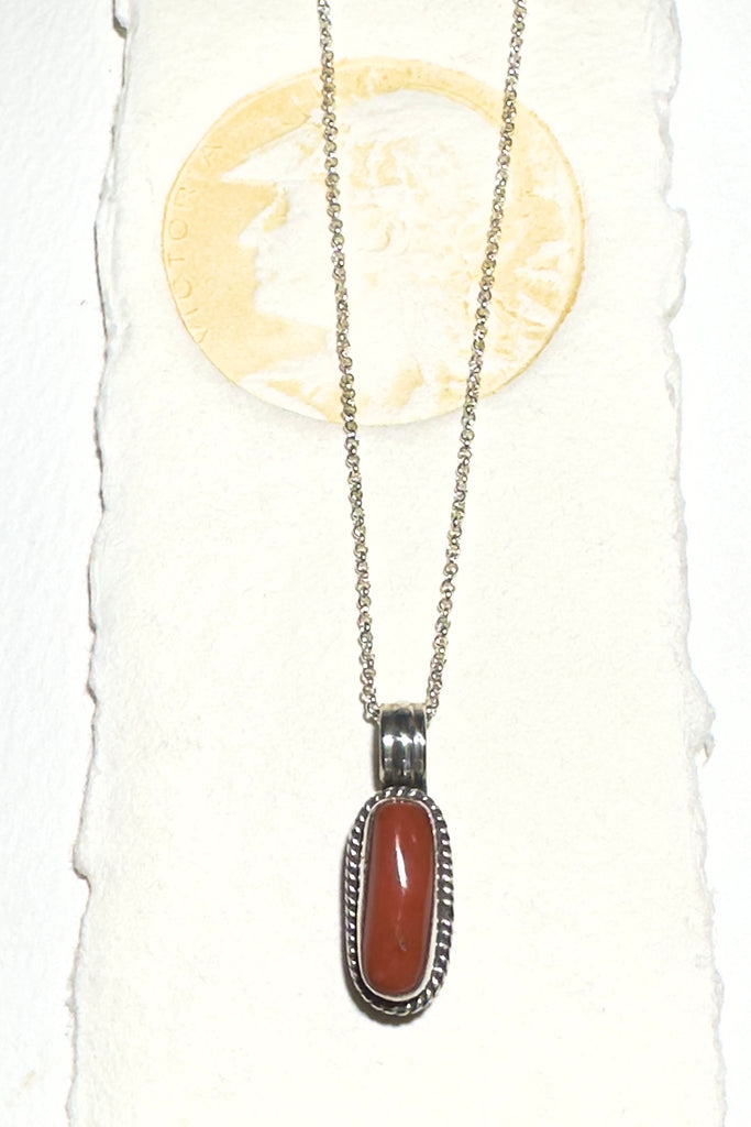 Red Coral Vintage Pendant&nbsp; Oval is an old piece that has a "village make" feel to it. Made in 925 silver 