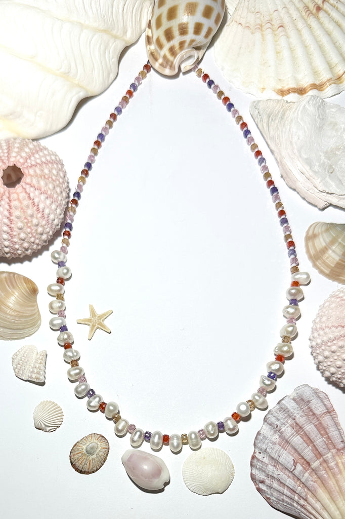 A pearl necklace to make you feel so special, luminescent creamy white pearls with a pop of pretty colour, feel the calm of the islands.&nbsp;

Freshwater pearls, micro faceted multicoloured CZ beads.