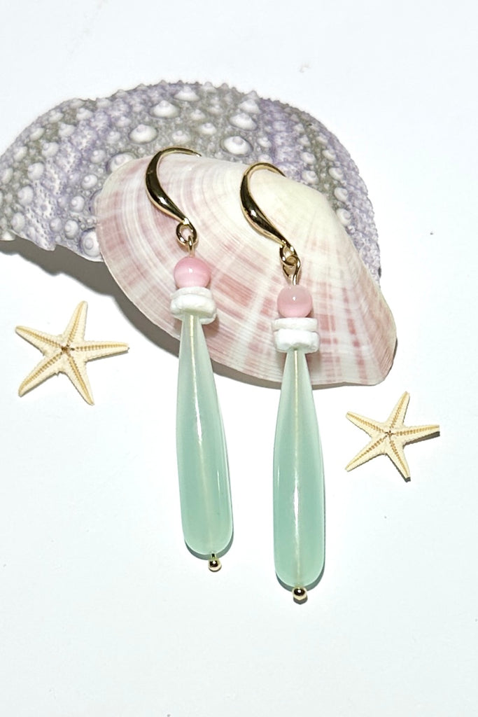 Lovely delicately coloured drop earrings, a perfectly the palest pretty green with hand cut seashell disc beads and a tiny pop of pink, as soft as a summer breeze.

Pale green Quartz with seashell and Mother of Pearl top stones.