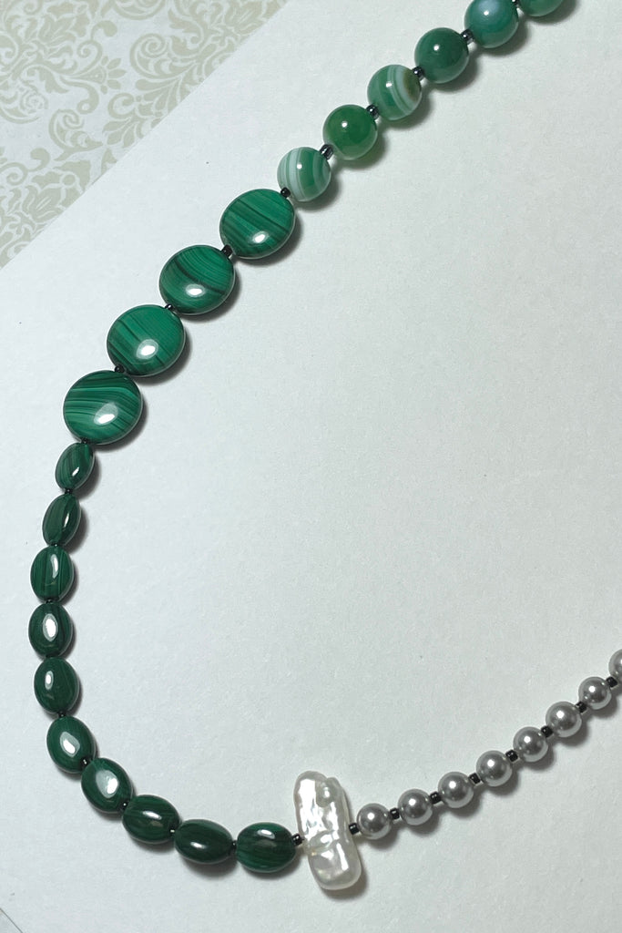 The necklace is made with three different shapes of green Malachite stone with a highlight of round grey pearls and one creamy white pearl. Hand made exclusively in Australia for Mombasa Rose Boutique, this is a one off piece, there will never be another.