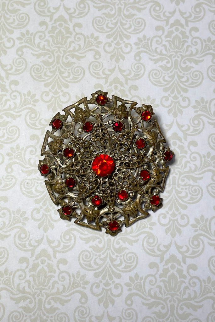 From the Edwardian era, it features a centre rhinestone in the centre and smaller stones that are all claw set. This is a large statement piece with a wonderful Boho and delicate style. 