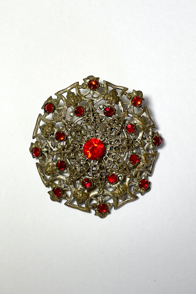 From the Edwardian era, it features a centre rhinestone in the centre and smaller stones that are all claw set. This is a large statement piece with a wonderful Boho and delicate style. 
