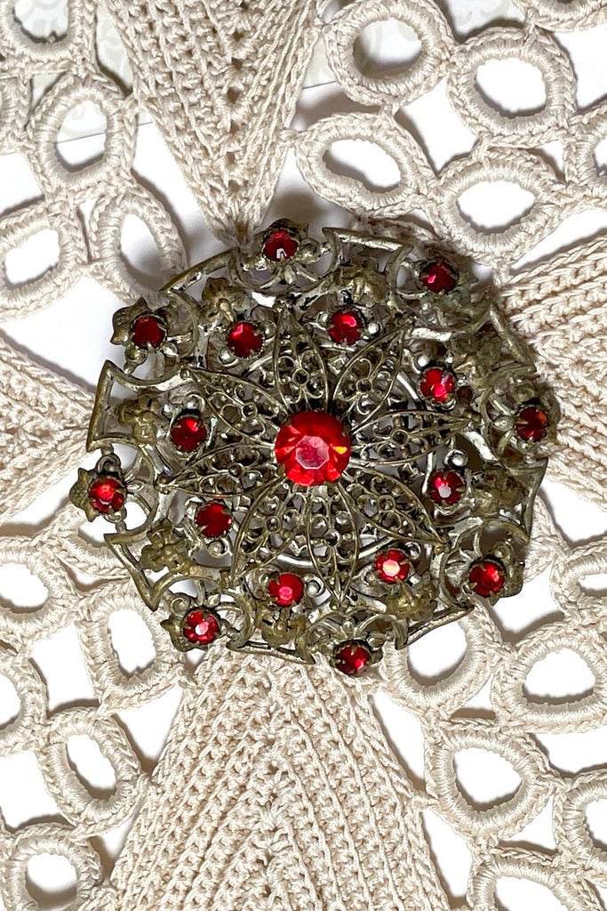 From the Edwardian era, it features a centre rhinestone in the centre and smaller stones that are all claw set. This is a large statement piece with a wonderful Boho and delicate style. 