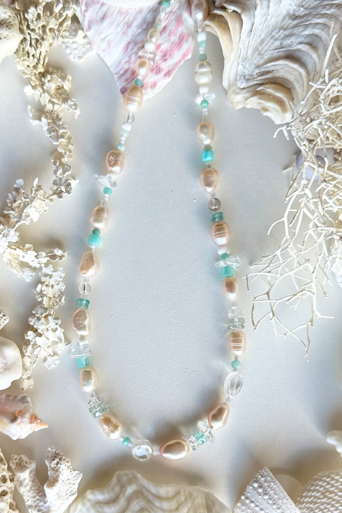 Tiny aqua drops on a tropical island lagoon, luminescent creamy white pearls with wave drops of palest blue Aquamarine and Amazonite beads, feel the calm of the islands.