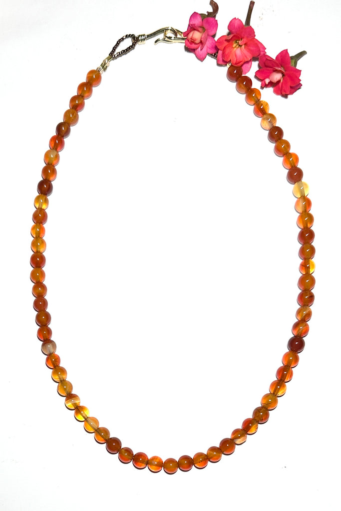 A gemstone bead necklace for everyday, for layering or to wear on its own. Golden amber coloured Carnelian beads.

5mm round polished Carnelian beads.