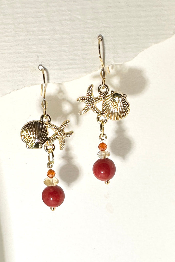 Drop earrings featuring bright red coloured bamboo coral bead, a shell and starfish highlight, a perfect&nbsp; swing style to add a pop of summer colour.

Red coloured bamboo coral and Citrine beads with brass shell and starfish.