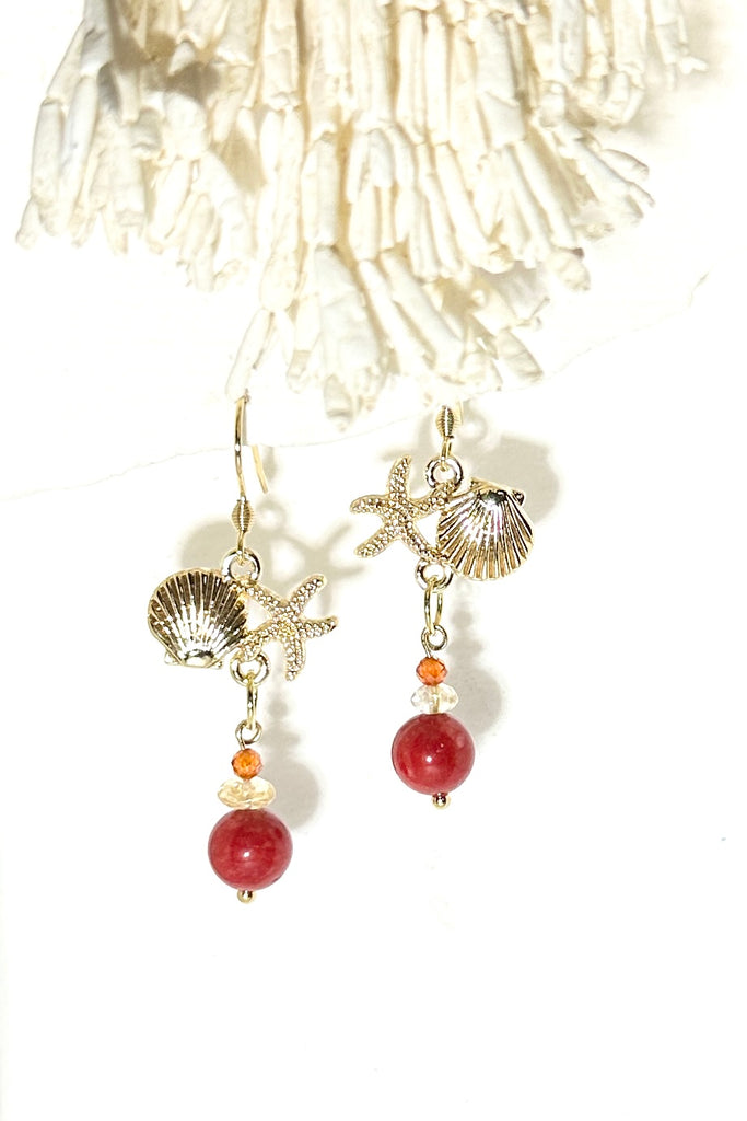 Drop earrings featuring bright red coloured bamboo coral bead, a shell and starfish highlight, a perfect&nbsp; swing style to add a pop of summer colour.

Red coloured bamboo coral and Citrine beads with brass shell and starfish.